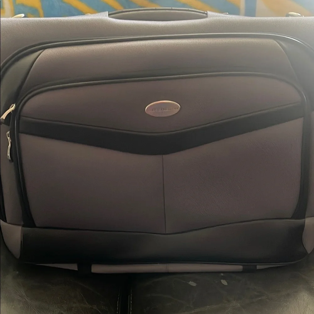 Black and Gray Travel Bags with Metal Accents